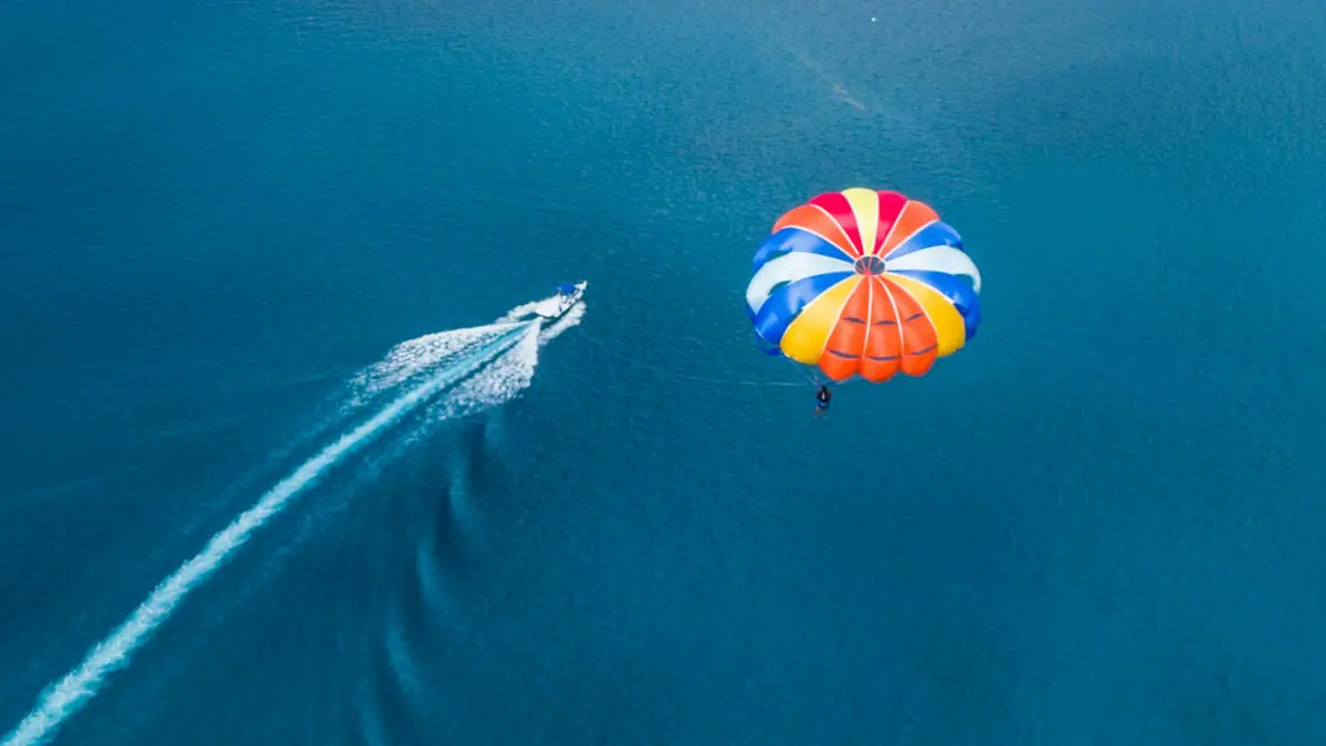 An aerial view of a parasail canopy above open sea