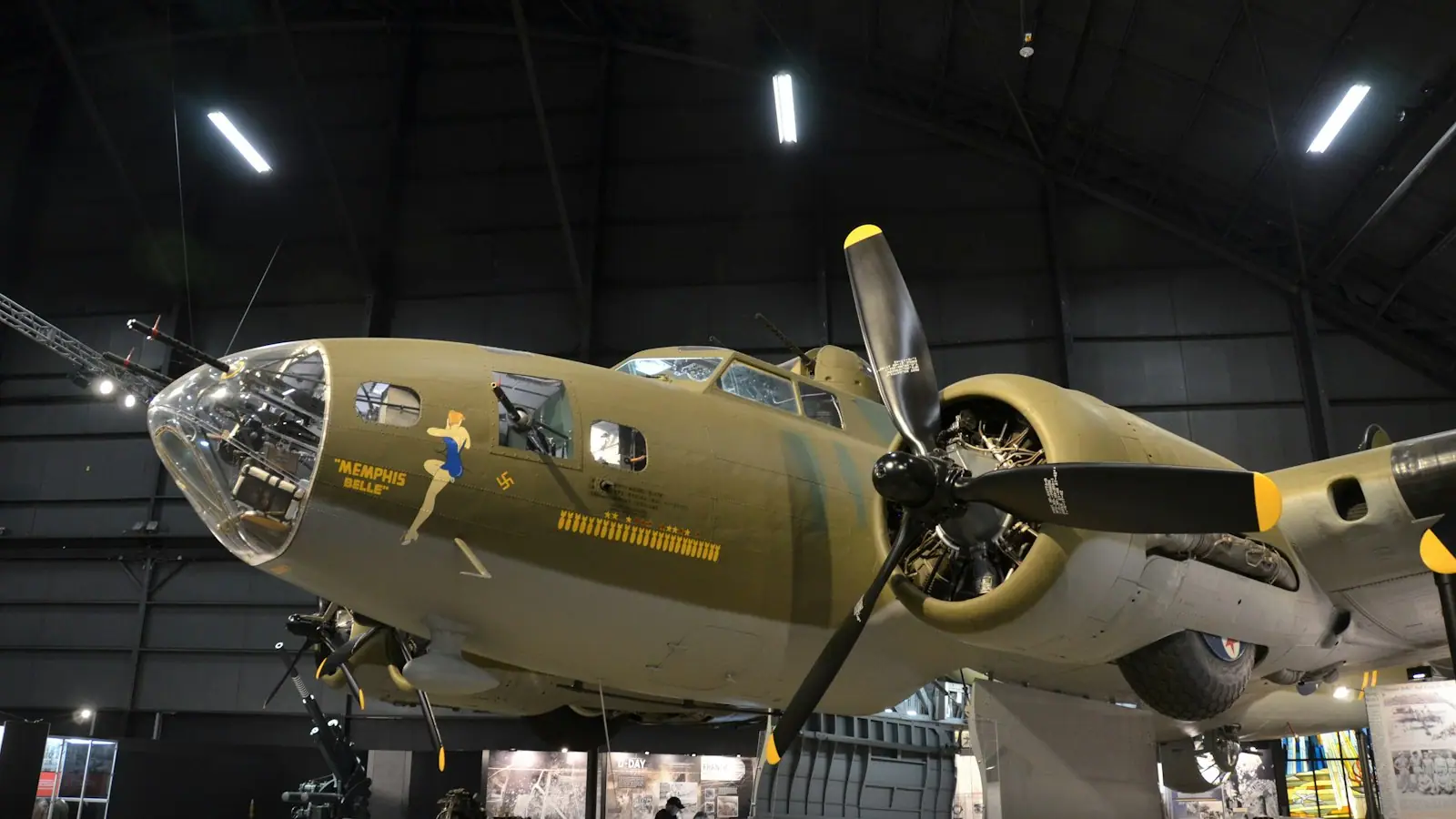 A large propeller-driven aircraft displayed inside a museum hangar